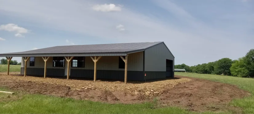 Post-frame building with covered porch by D.T. Construction