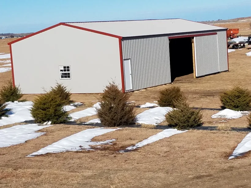 Post-frame building in winter by D.T. Construction