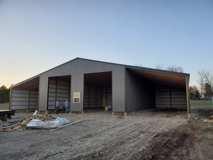 Post-frame building with open bays by D.T. Construction